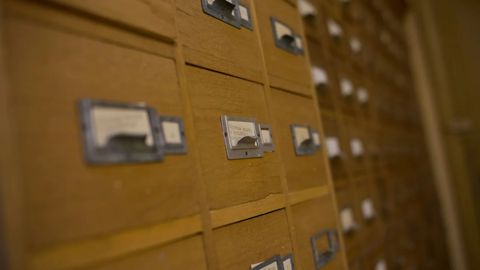 Rows of small wooden index card drawers