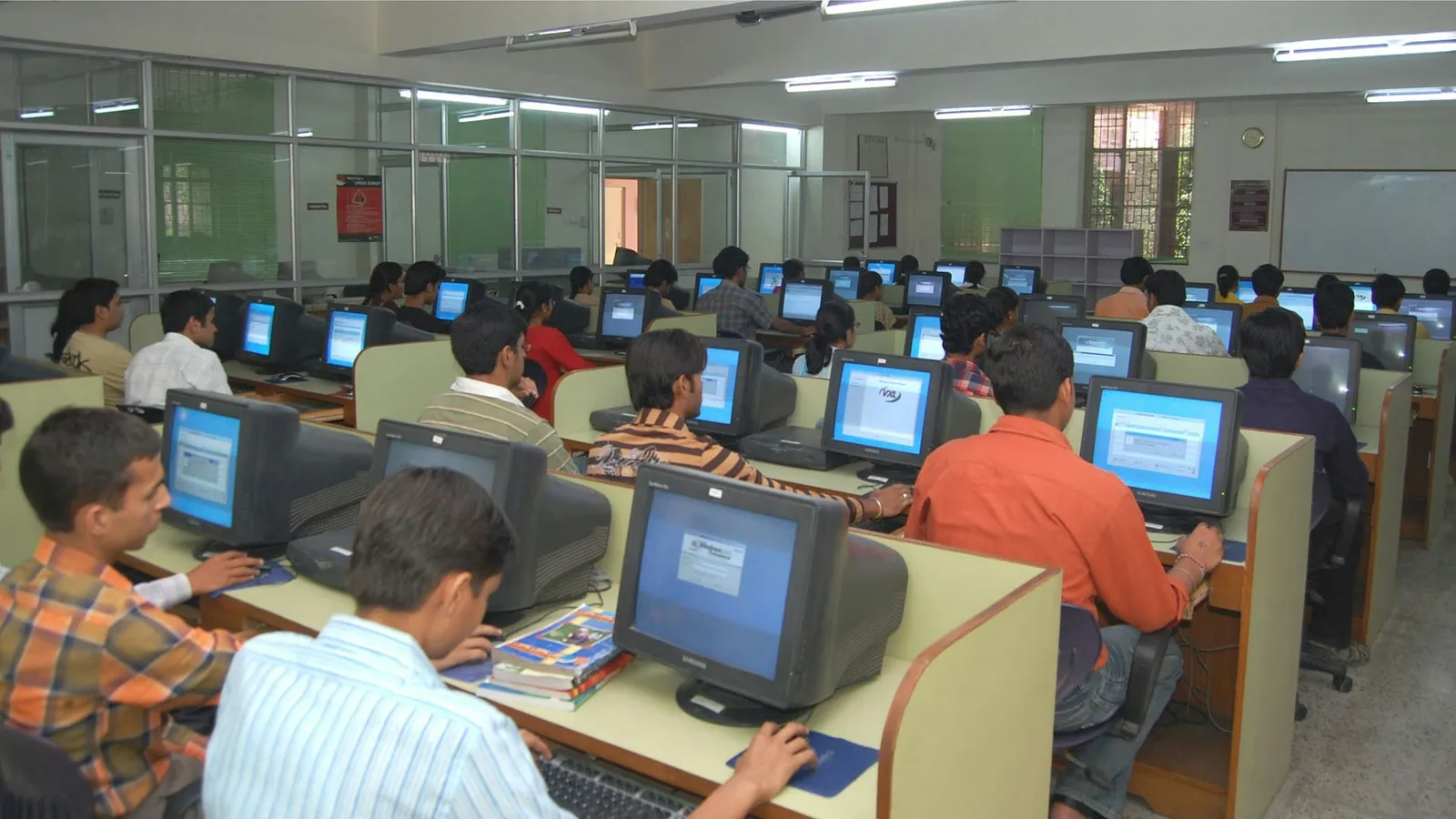 Rows of students taking a test on computers