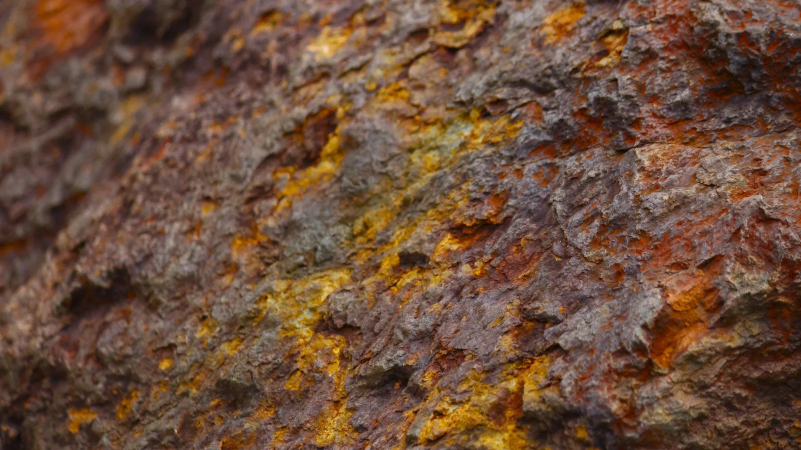 Rust-coloured mineral rock up close