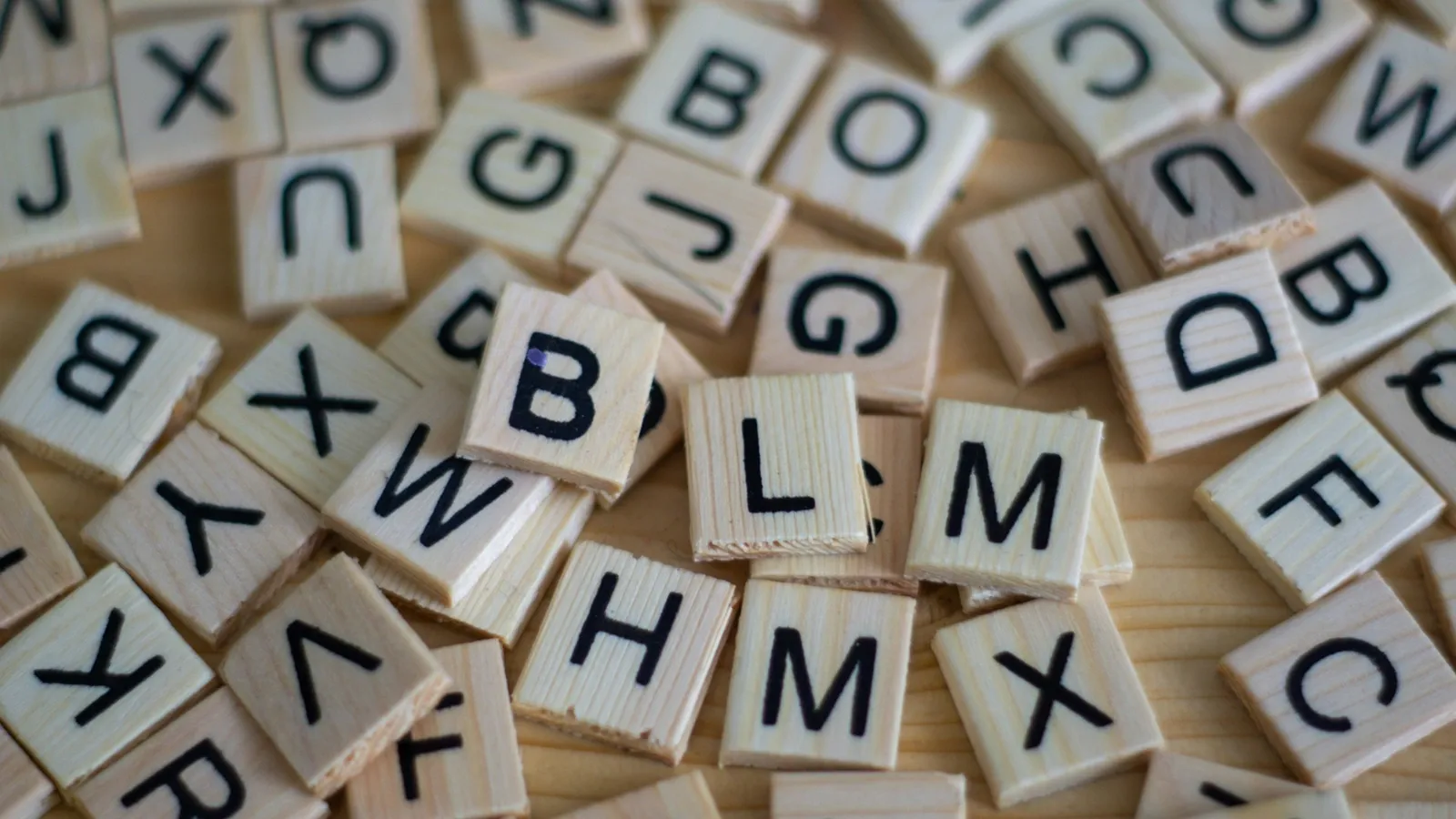 Scattered wooden letter tiles