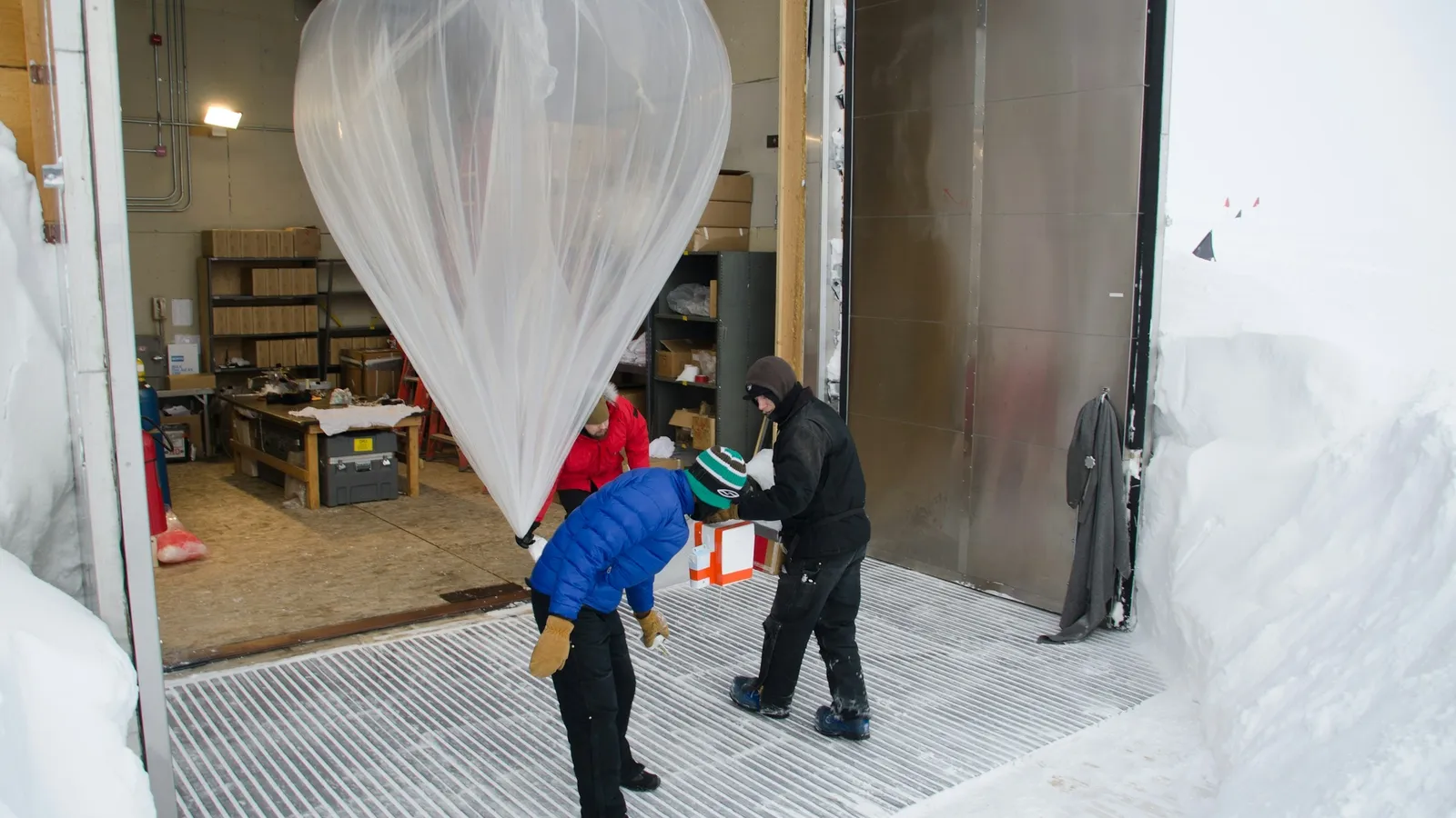 Scientists launching a weather balloon