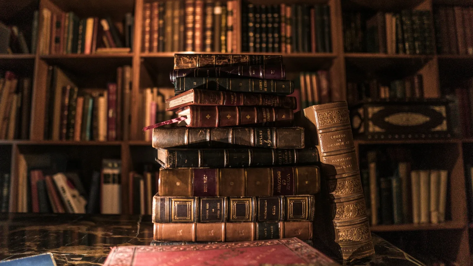 Shelves of old books in a wood-panelled library
