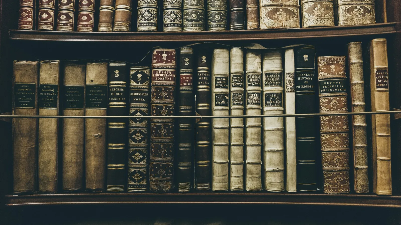 Shelves of old hardback books in a library
