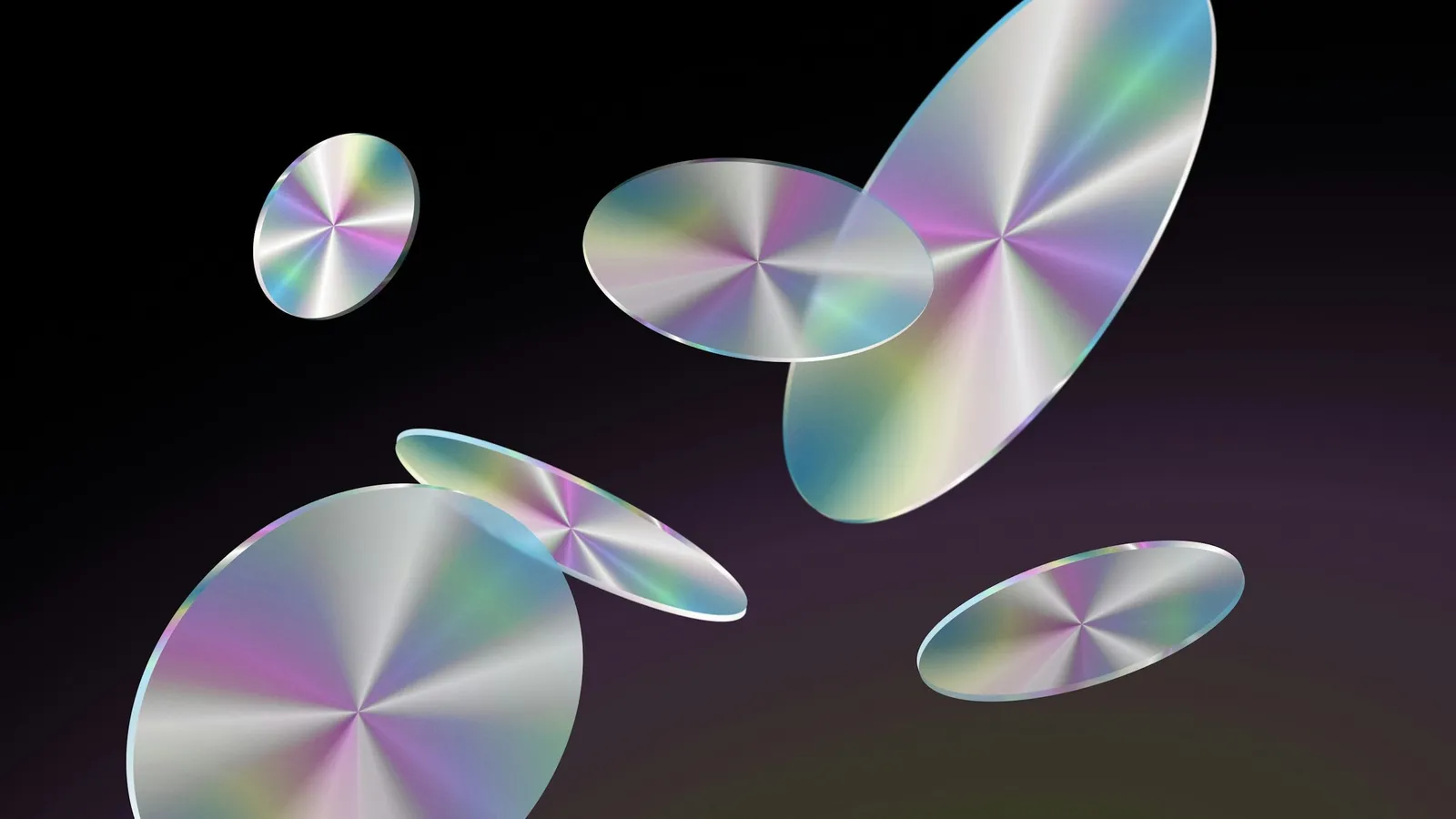 Shiny elliptical discs floating against a dark background