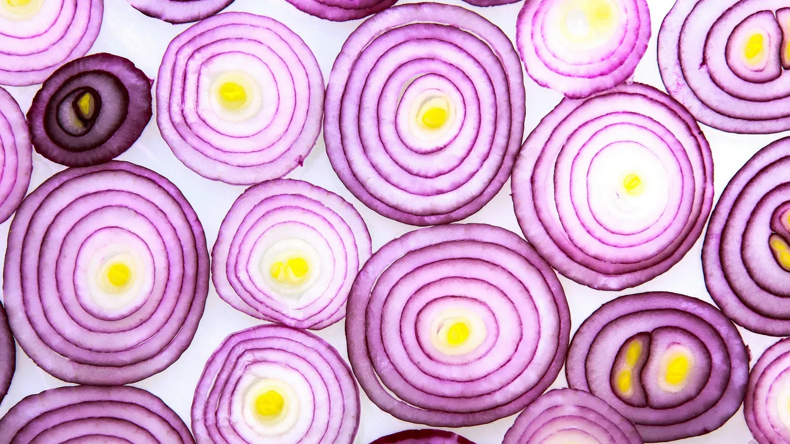 Sliced red onions showing their nested layers
