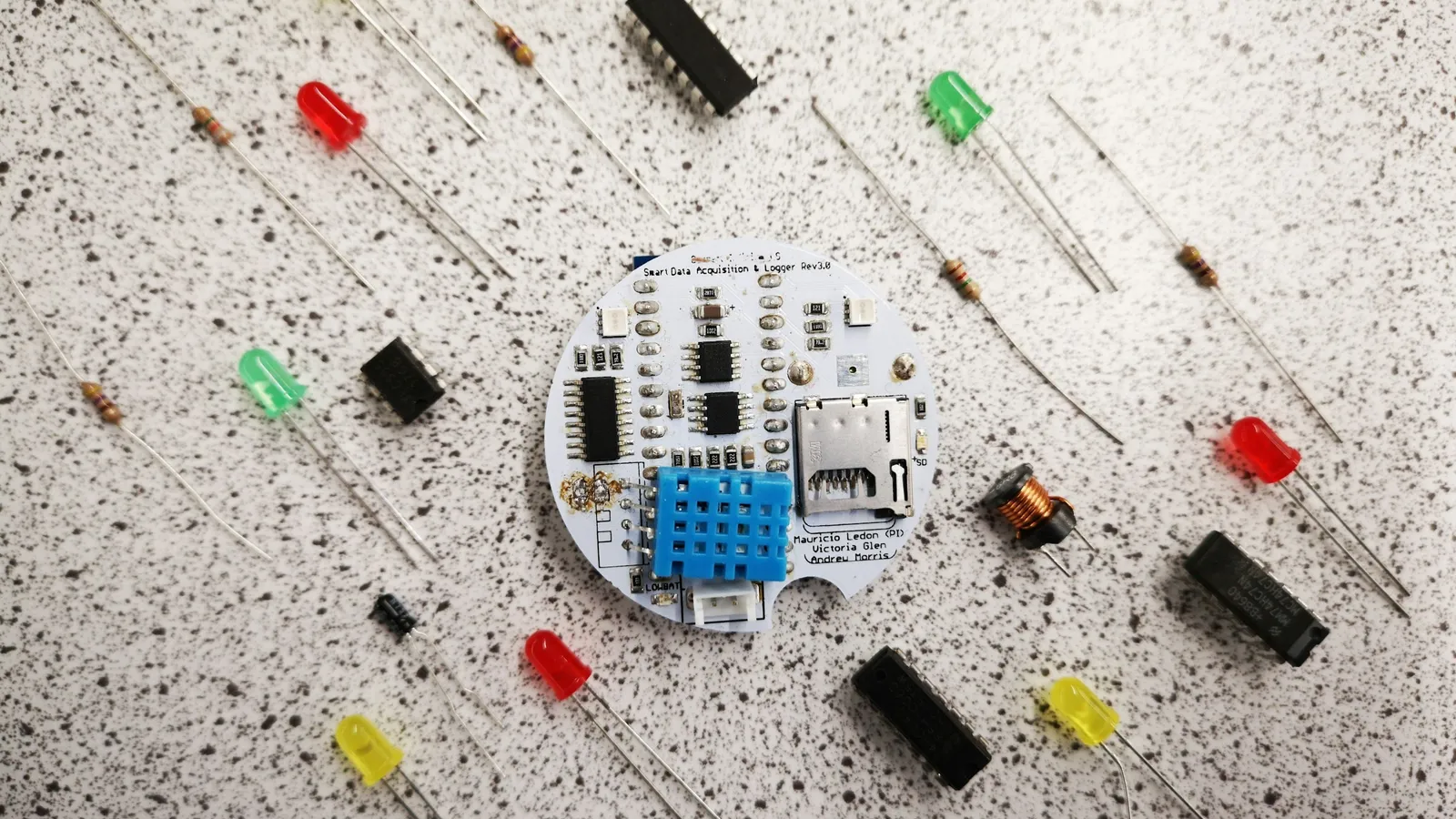 Small LEDs and electronic parts laid out on a white surface