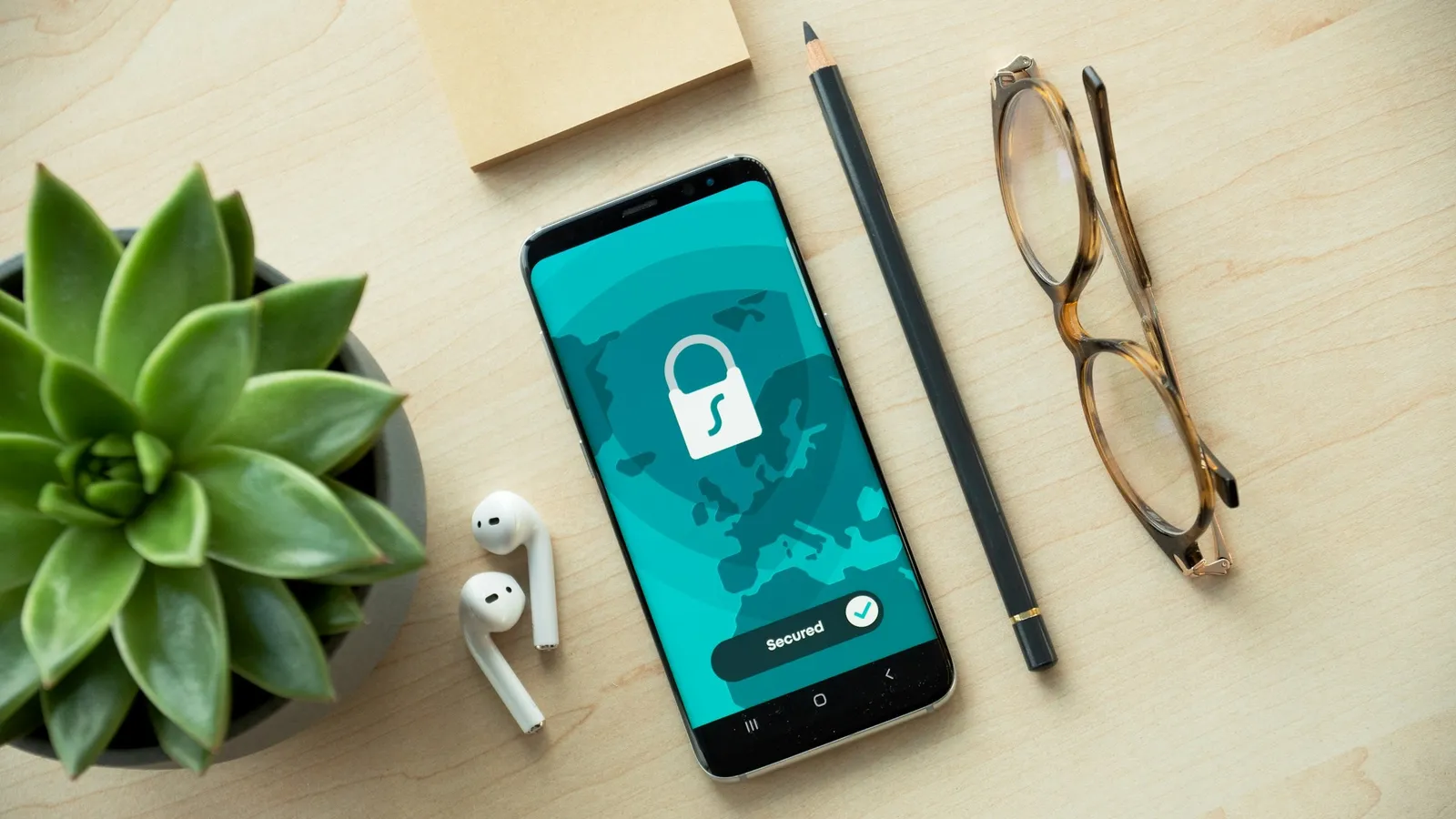 Smartphone showing a padlock icon on a desk