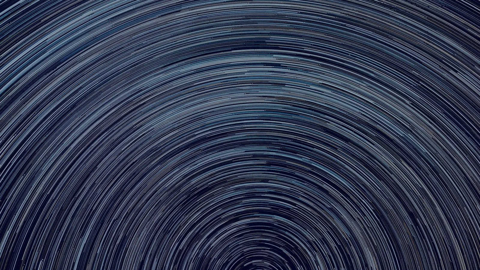 Star trails circling a point in the night sky