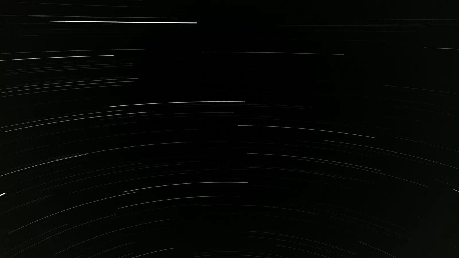 Star trails streaking across a dark night sky