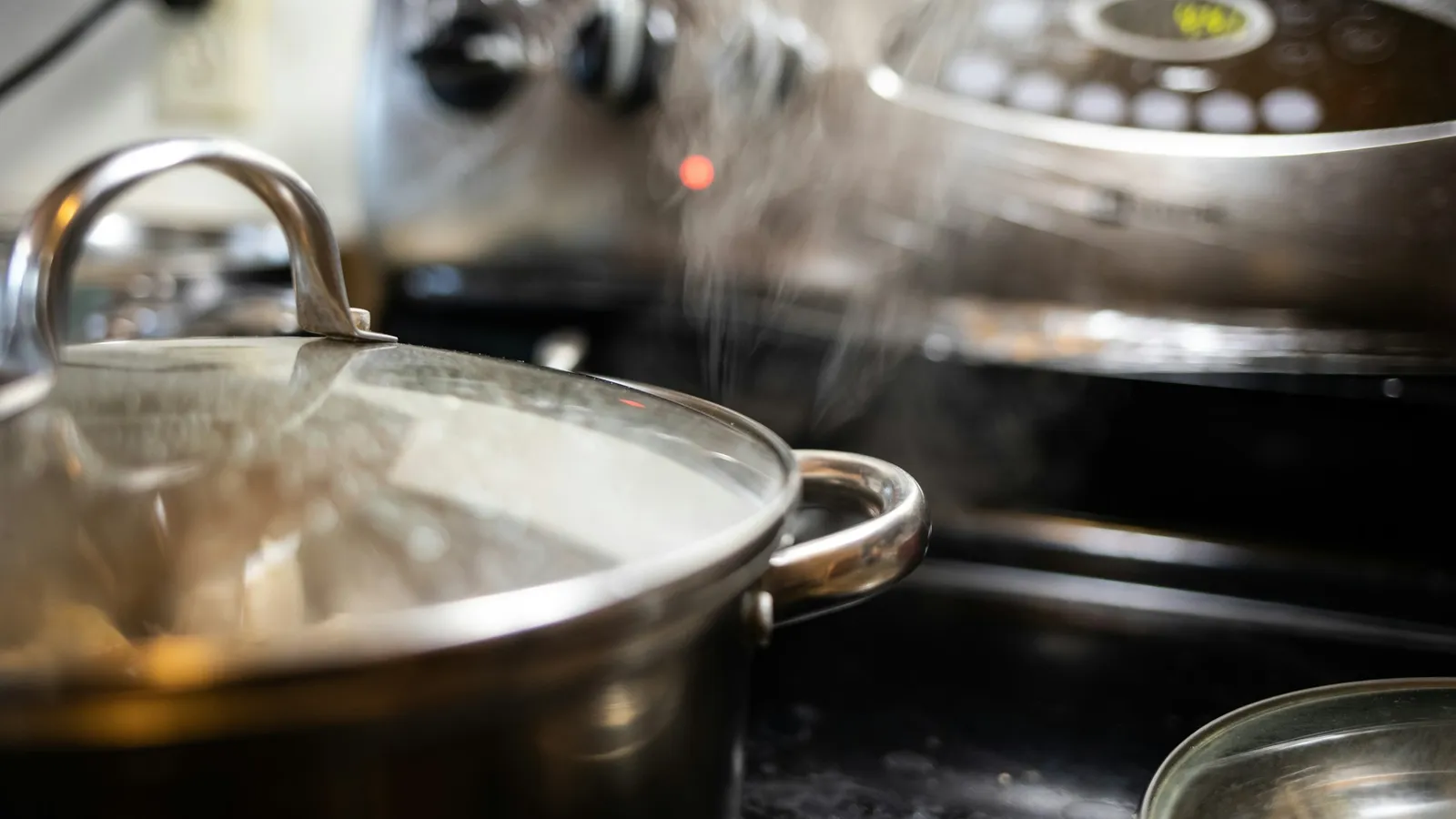 Steam rising from a pot of boiling water