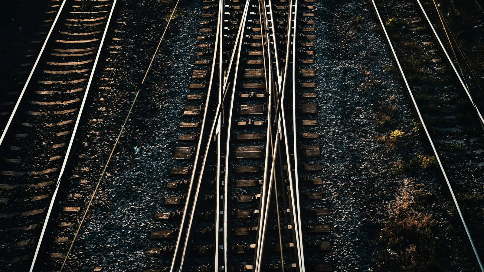Steel railway tracks meeting and branching