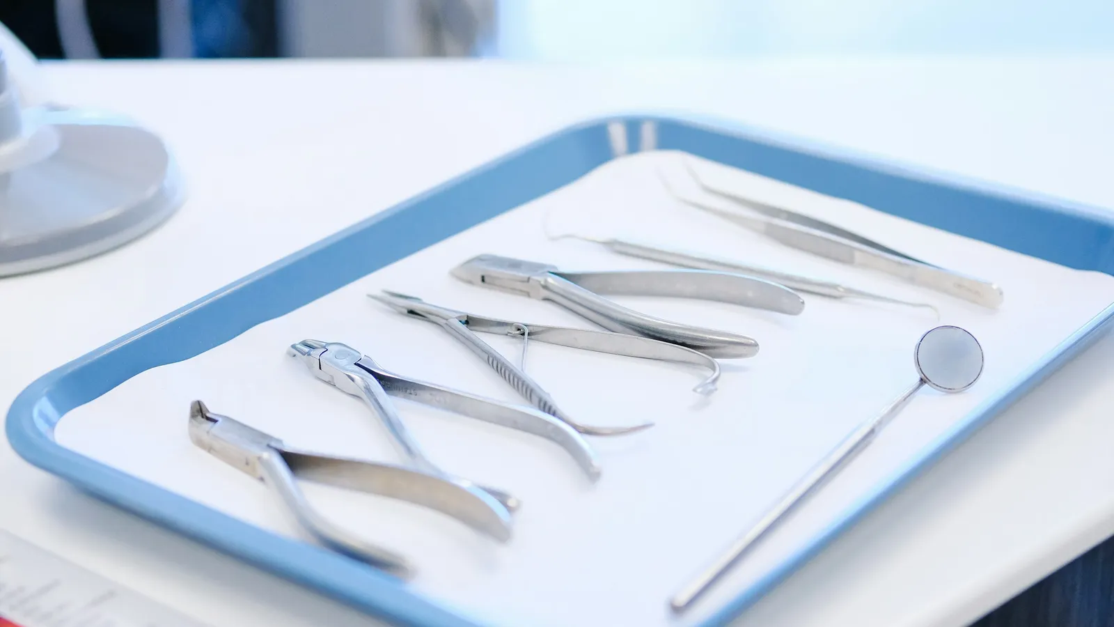 Steel surgical instruments laid out on a tray