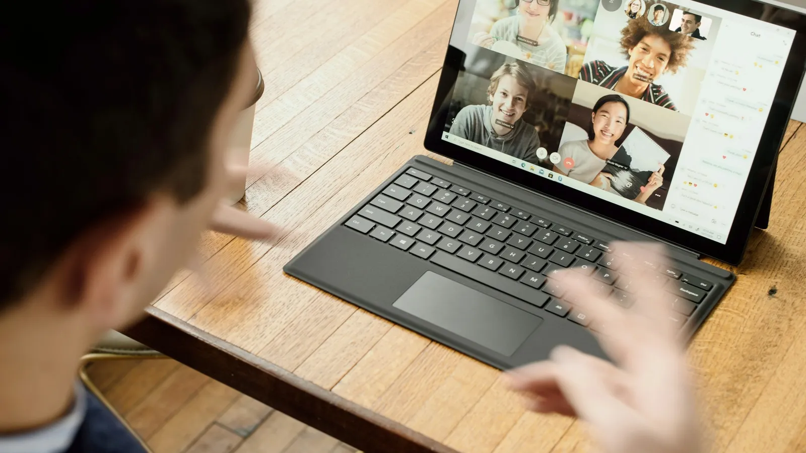 Student in an online video class on a laptop