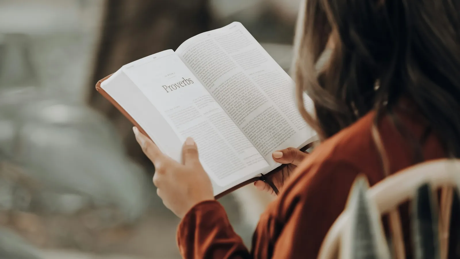 Student reading an open textbook