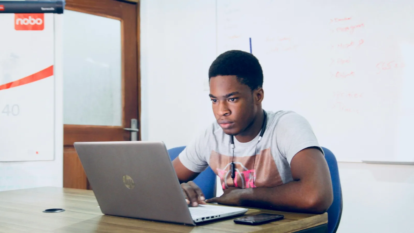 Student working on a laptop at a desk