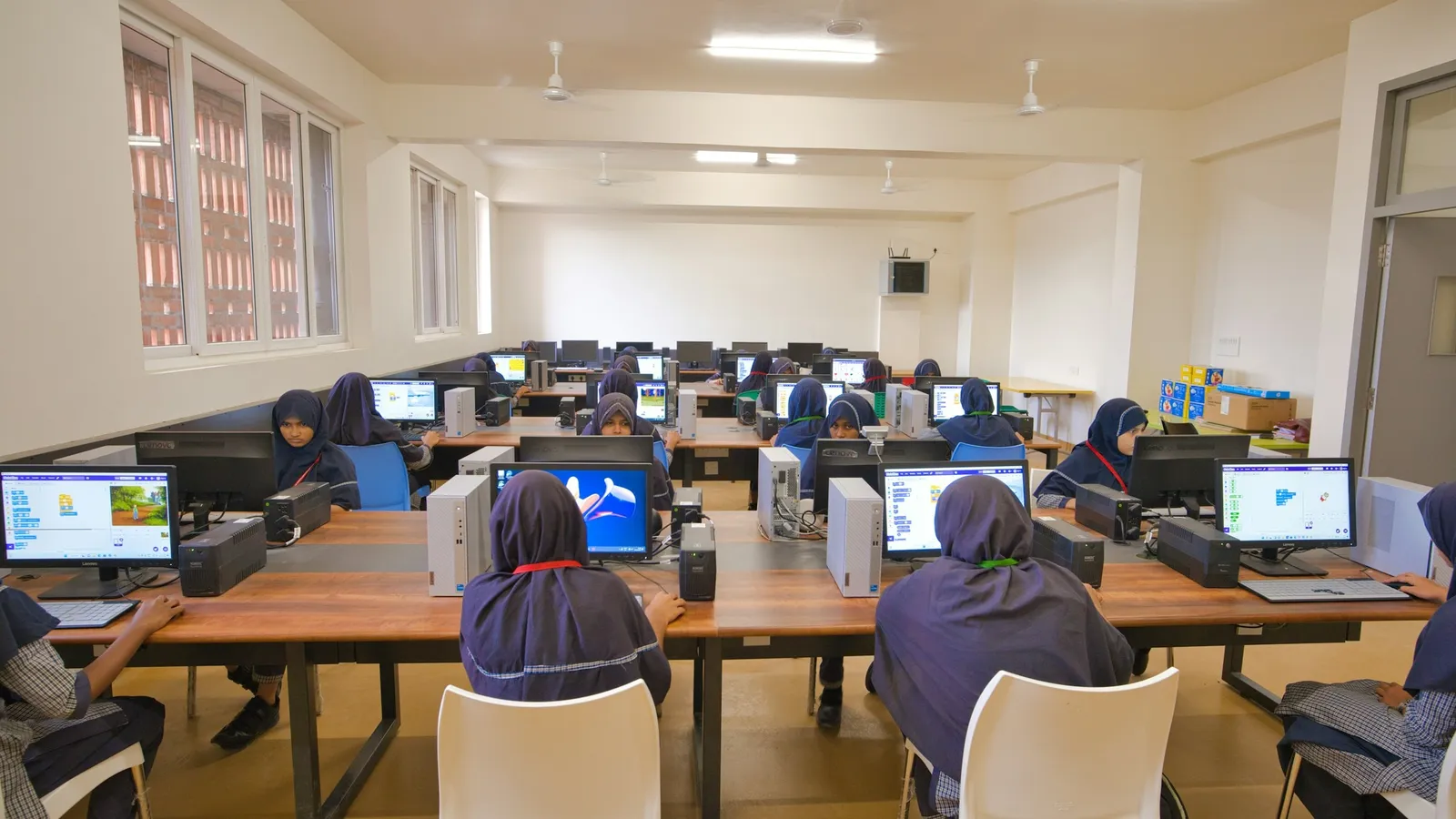 Students working at computers in a school computer lab