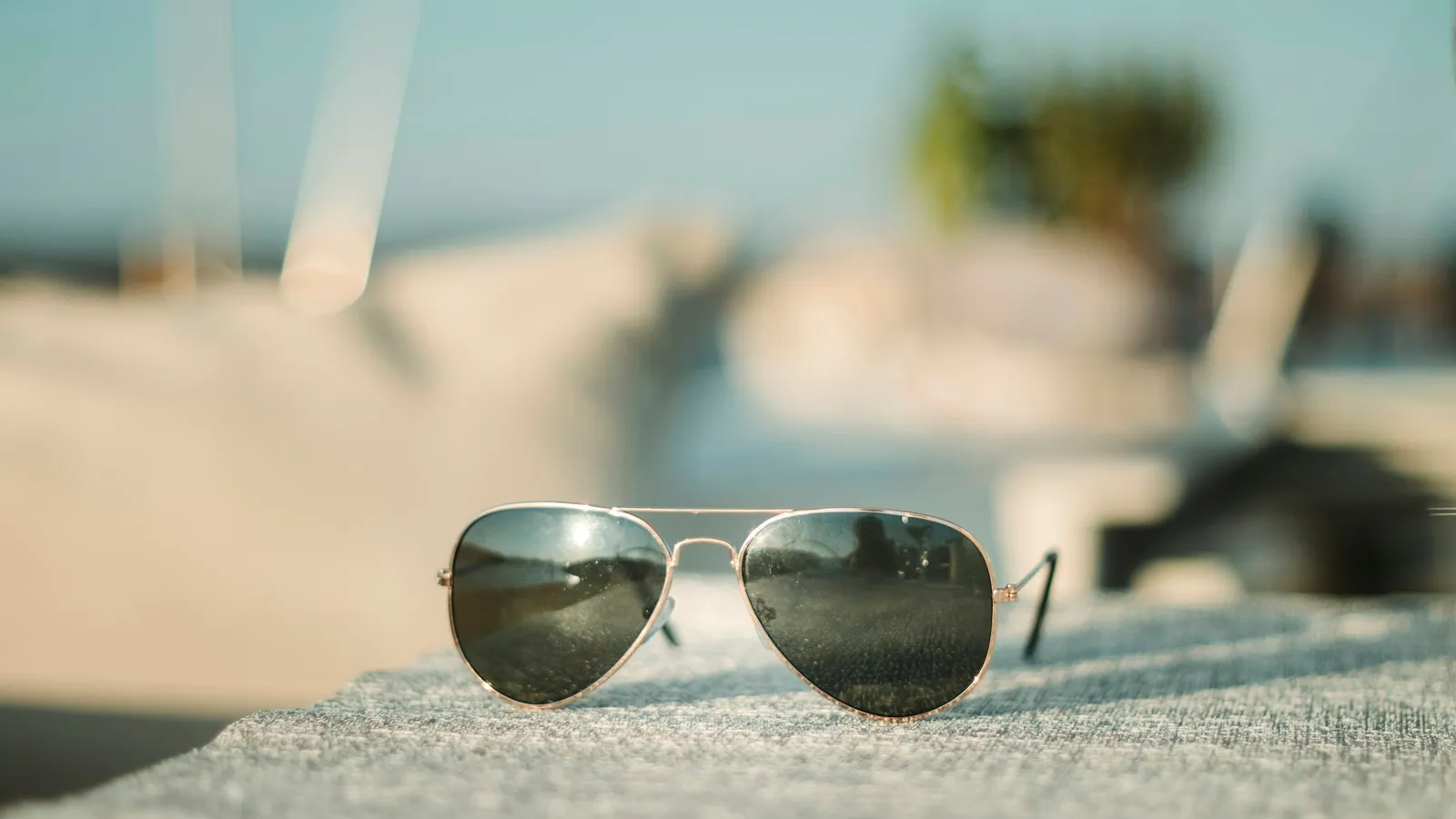 Sunglasses resting on a sunny beach