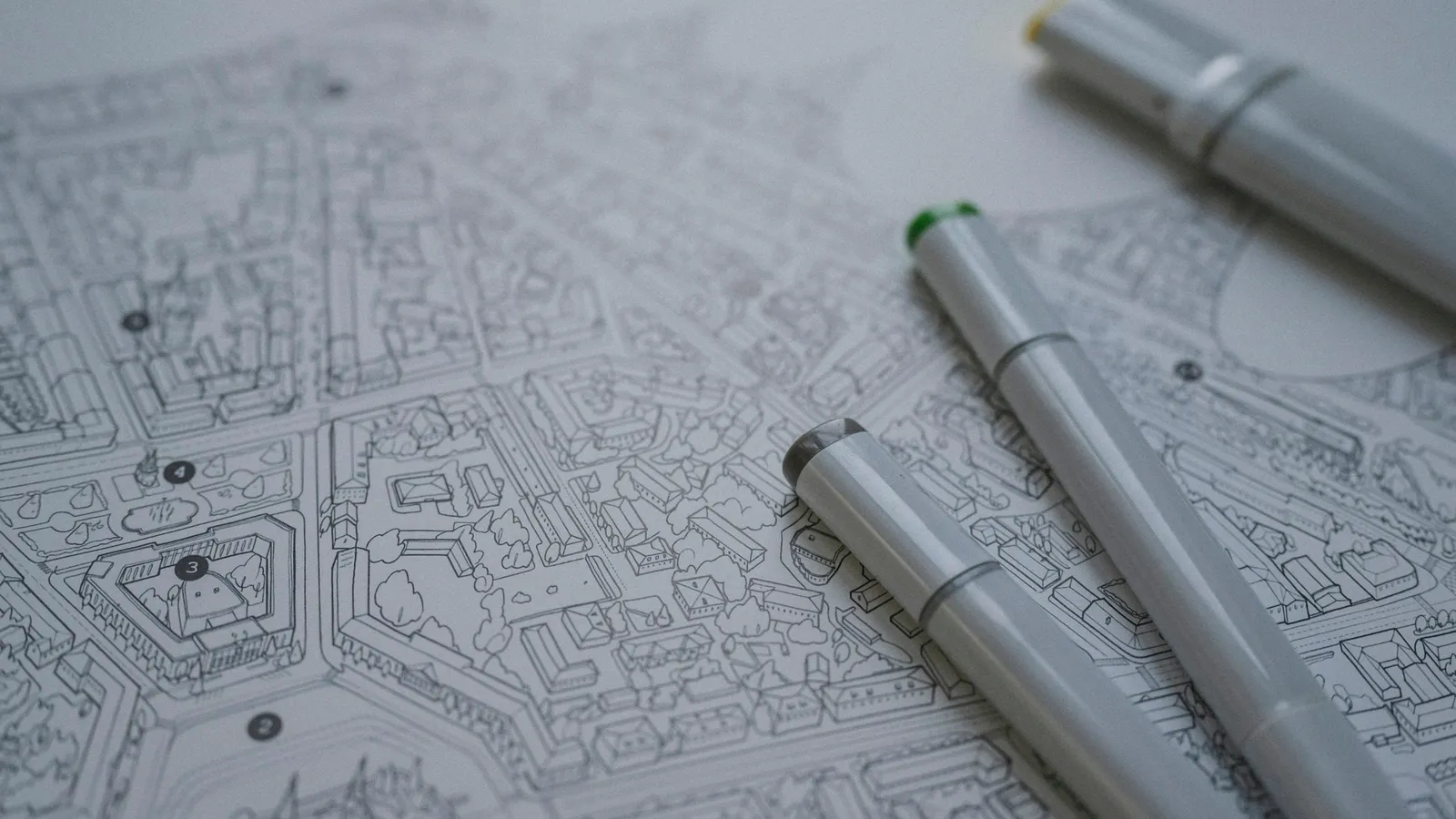 Technical drawings with pens on a desk