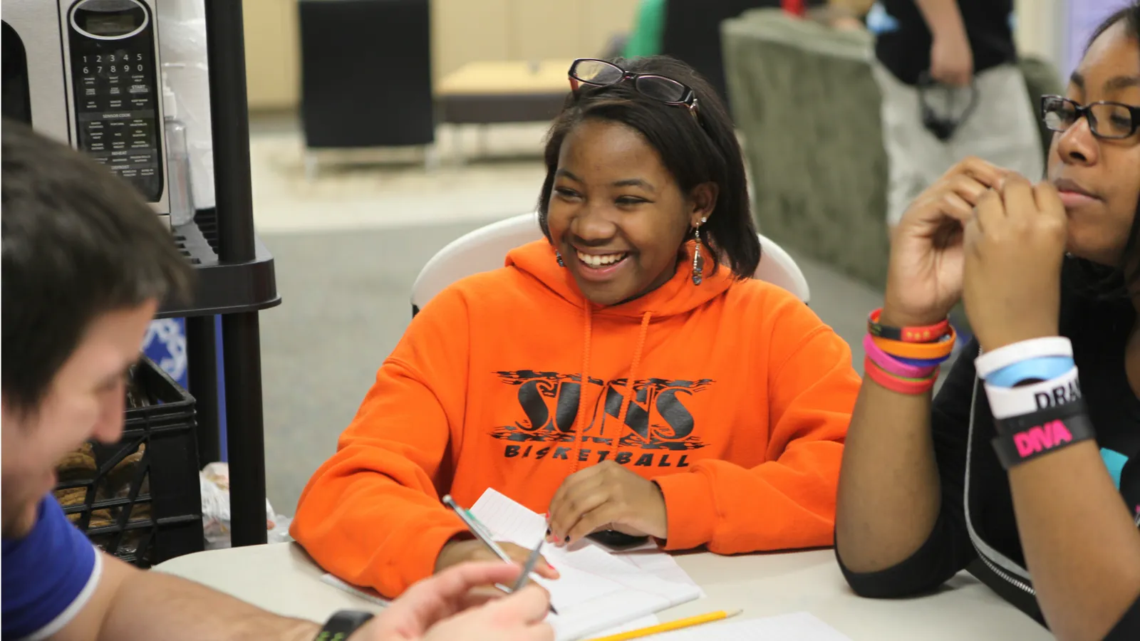 Teenage girl doing her homework at a community center