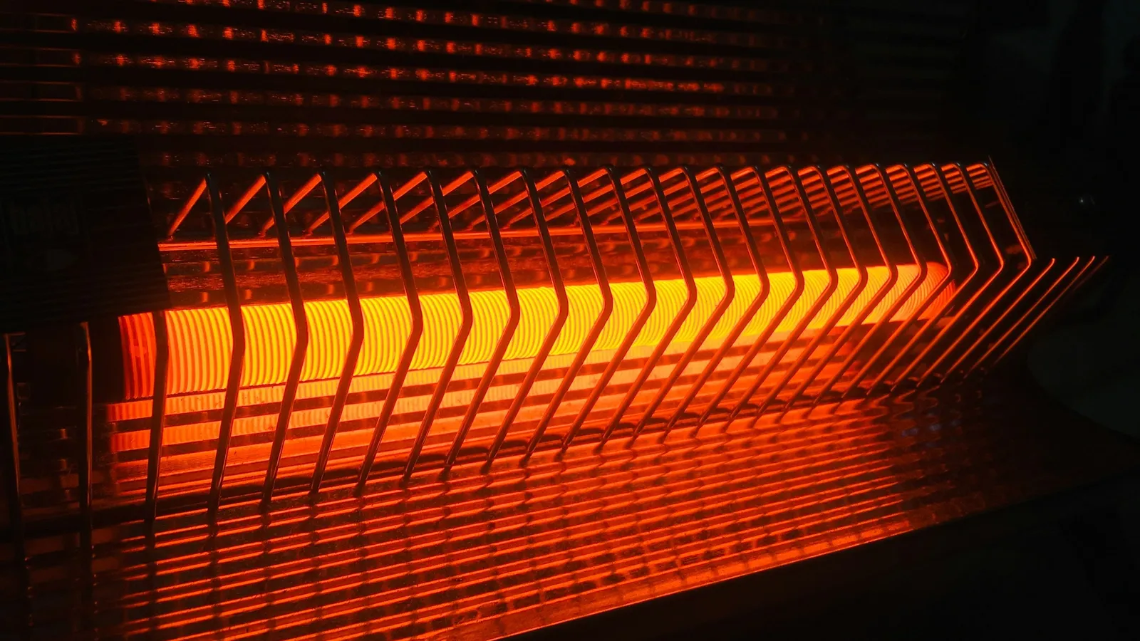 The glowing orange elements of an electric heater