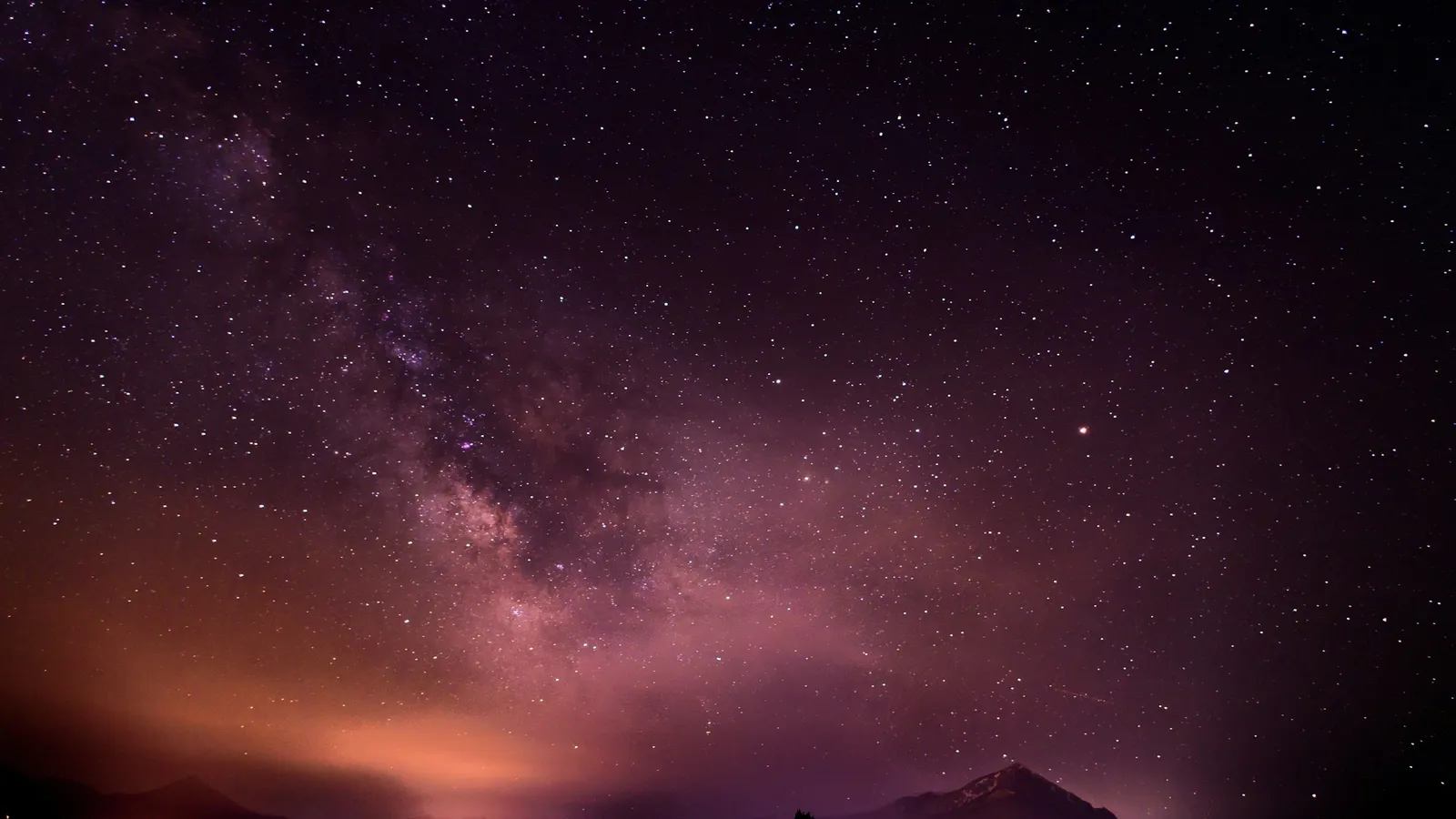 The Milky Way over hills at night