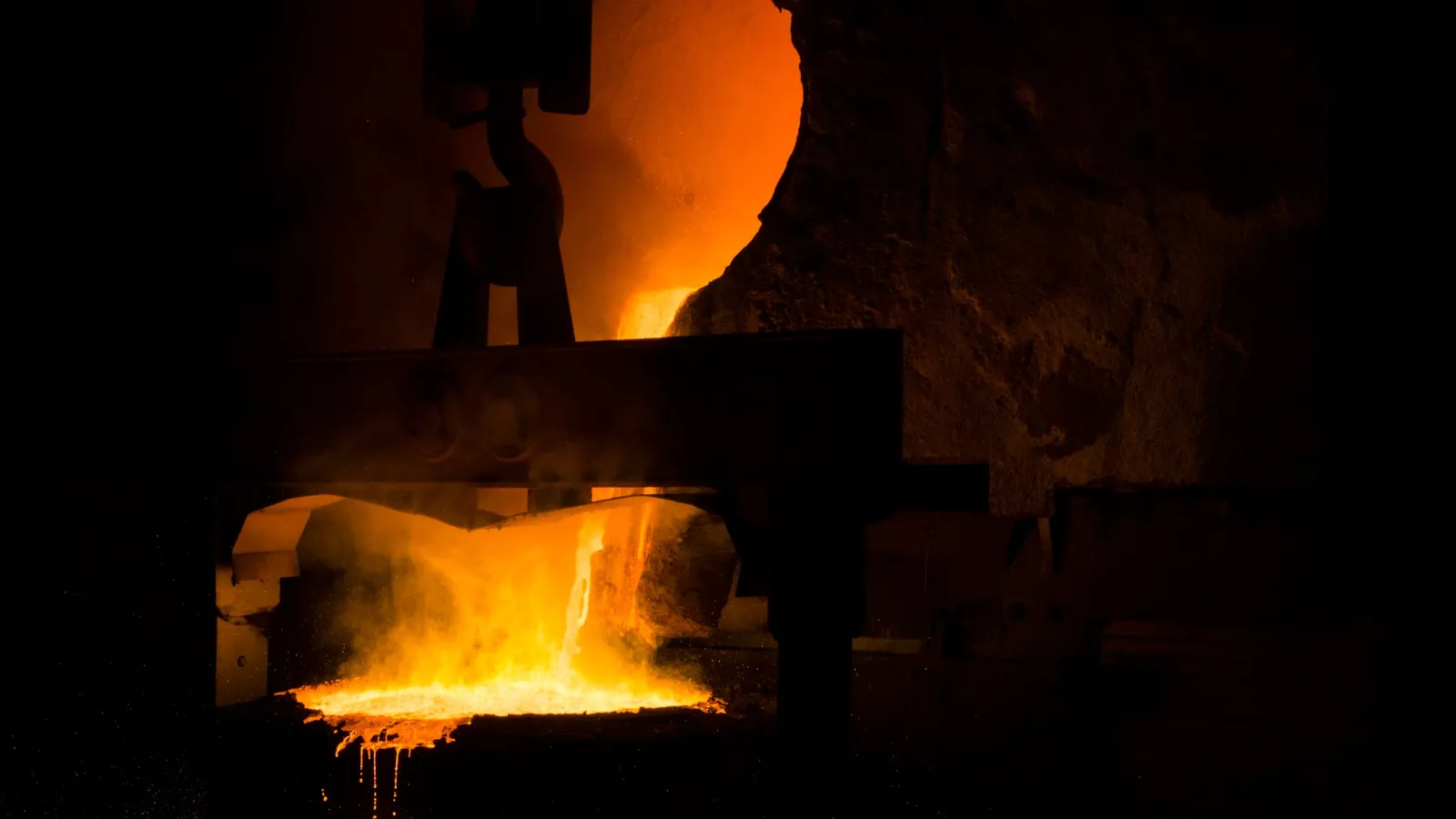 The orange glow of a furnace opening