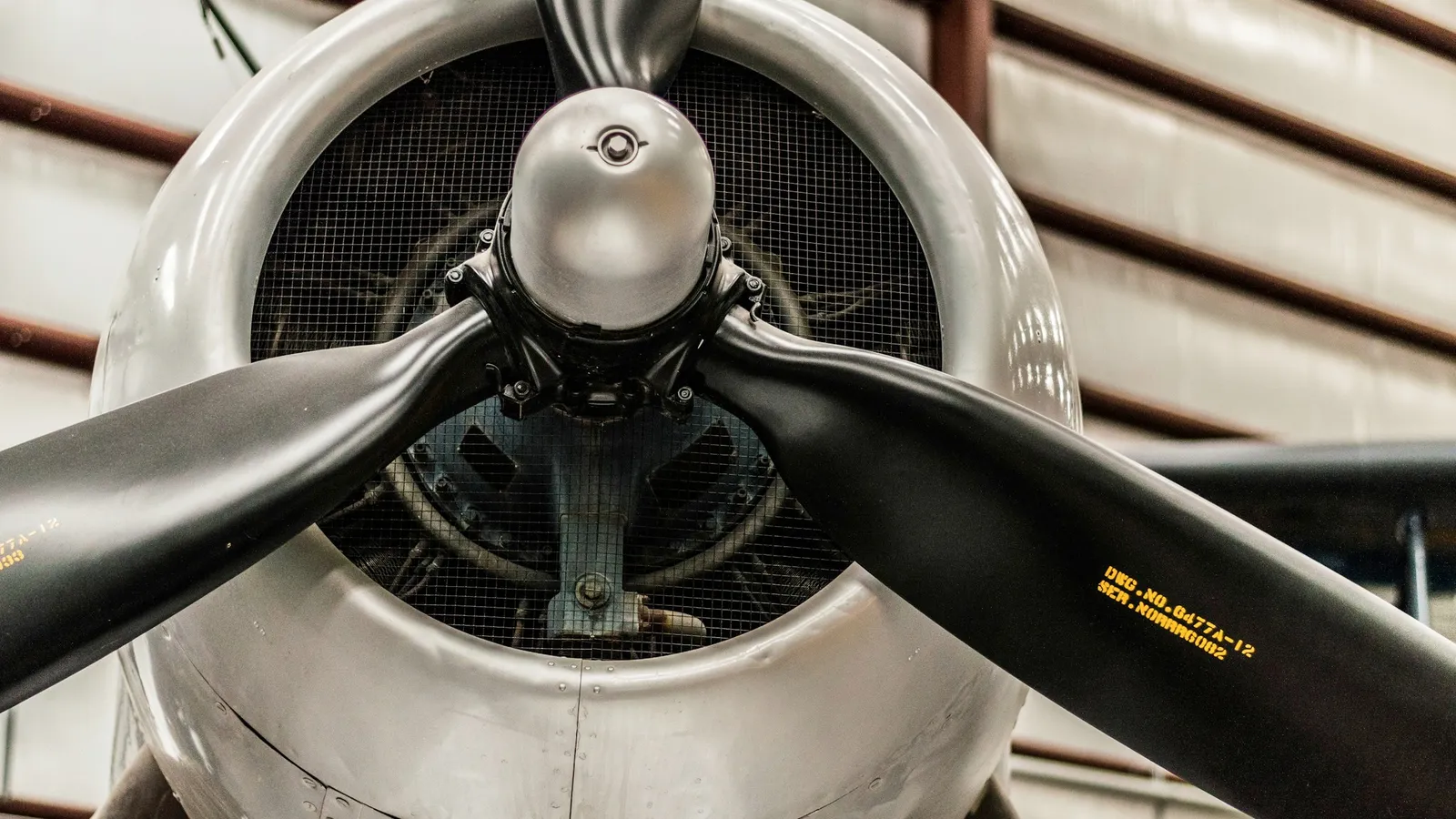 The propeller and engine of an old aircraft, seen head on