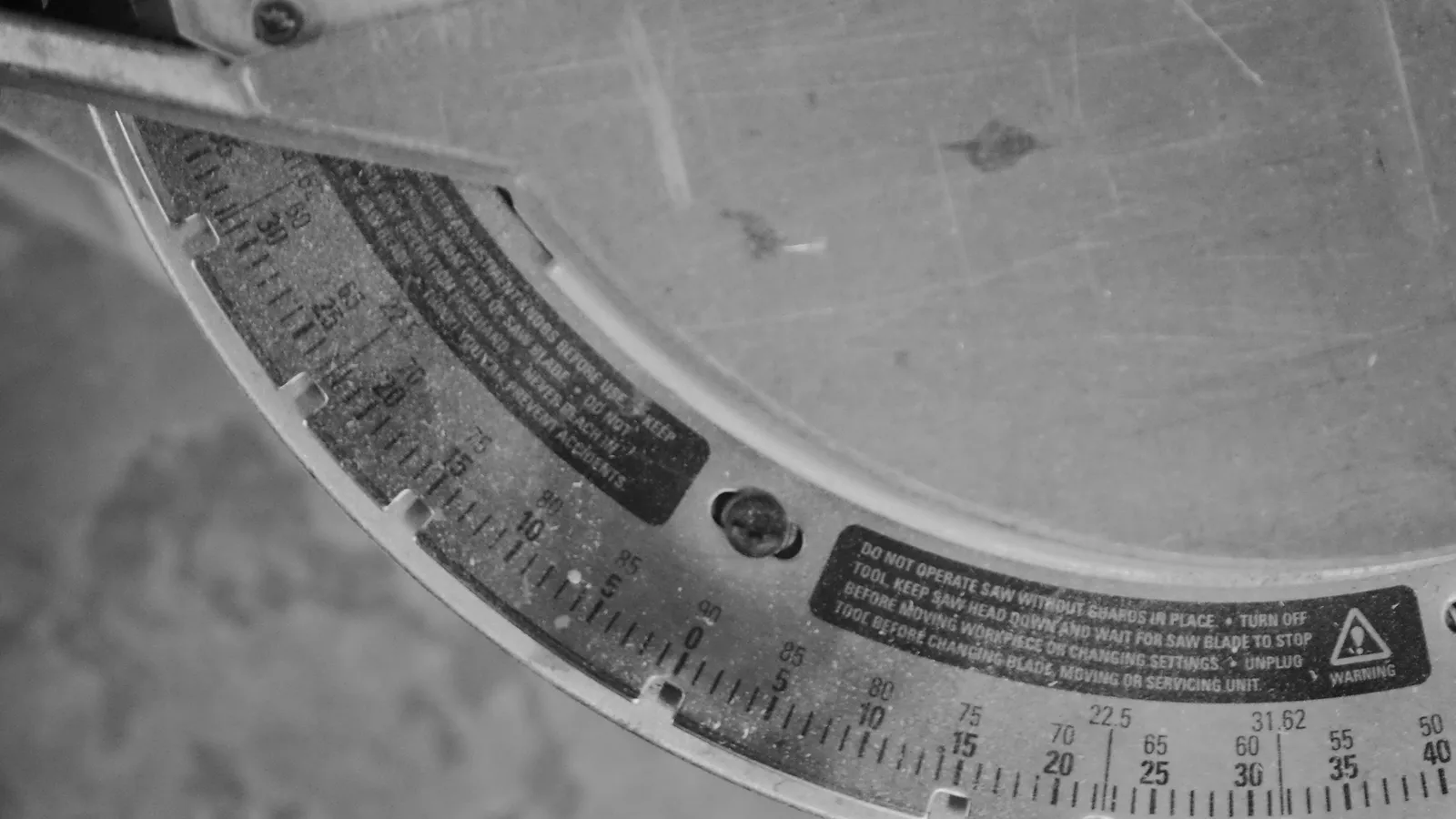 The scale on a metal protractor, in black and white