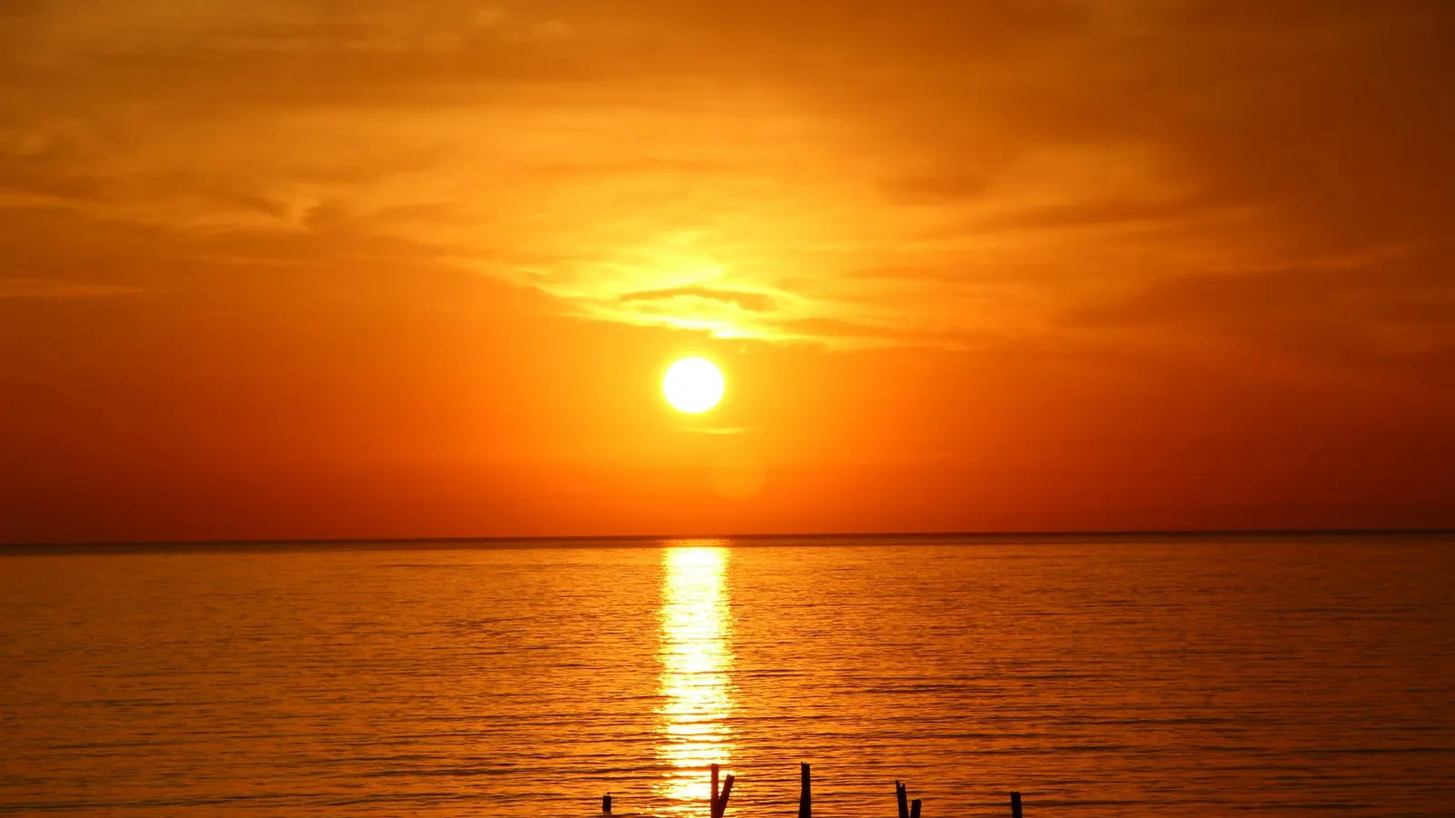 The Sun setting over a calm sea