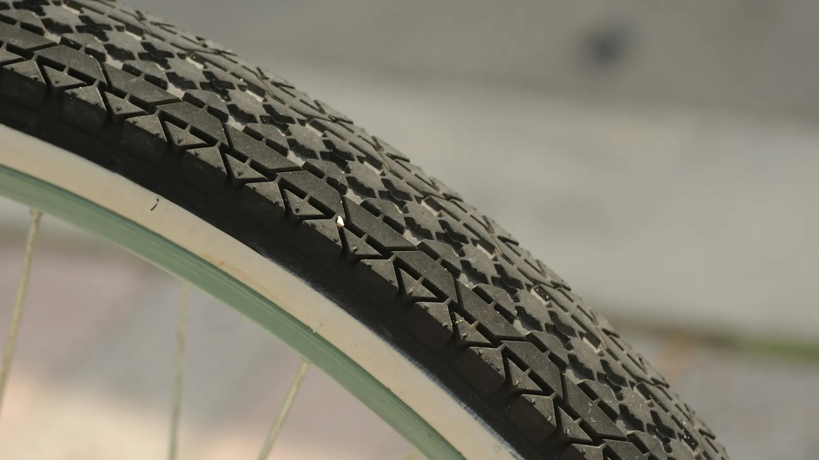 The treaded tyre of a bicycle wheel, close up