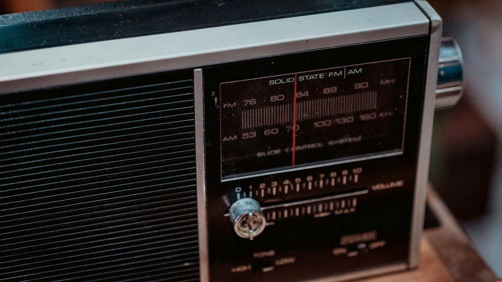 The tuning dial and speaker of an old radio