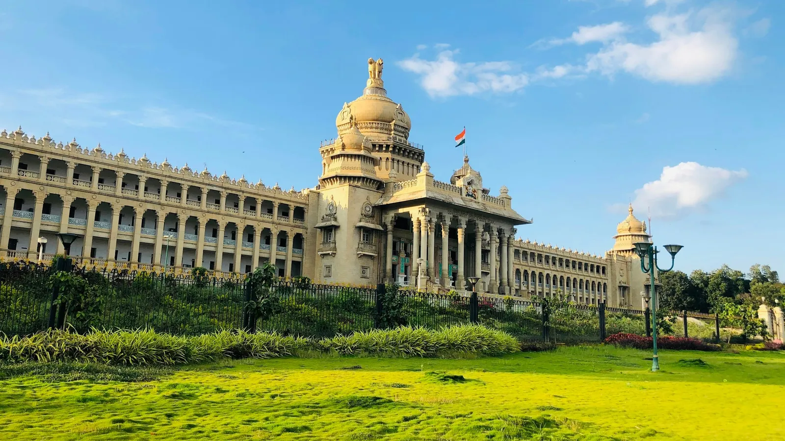 The Vidhana Soudha in Bengaluru behind a green lawn