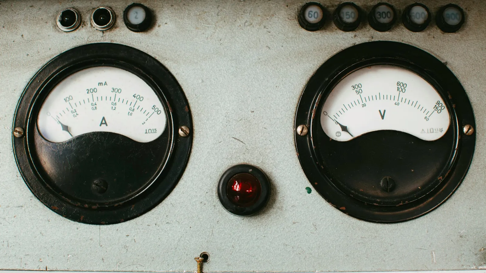 Two analogue meters with needle dials on a panel