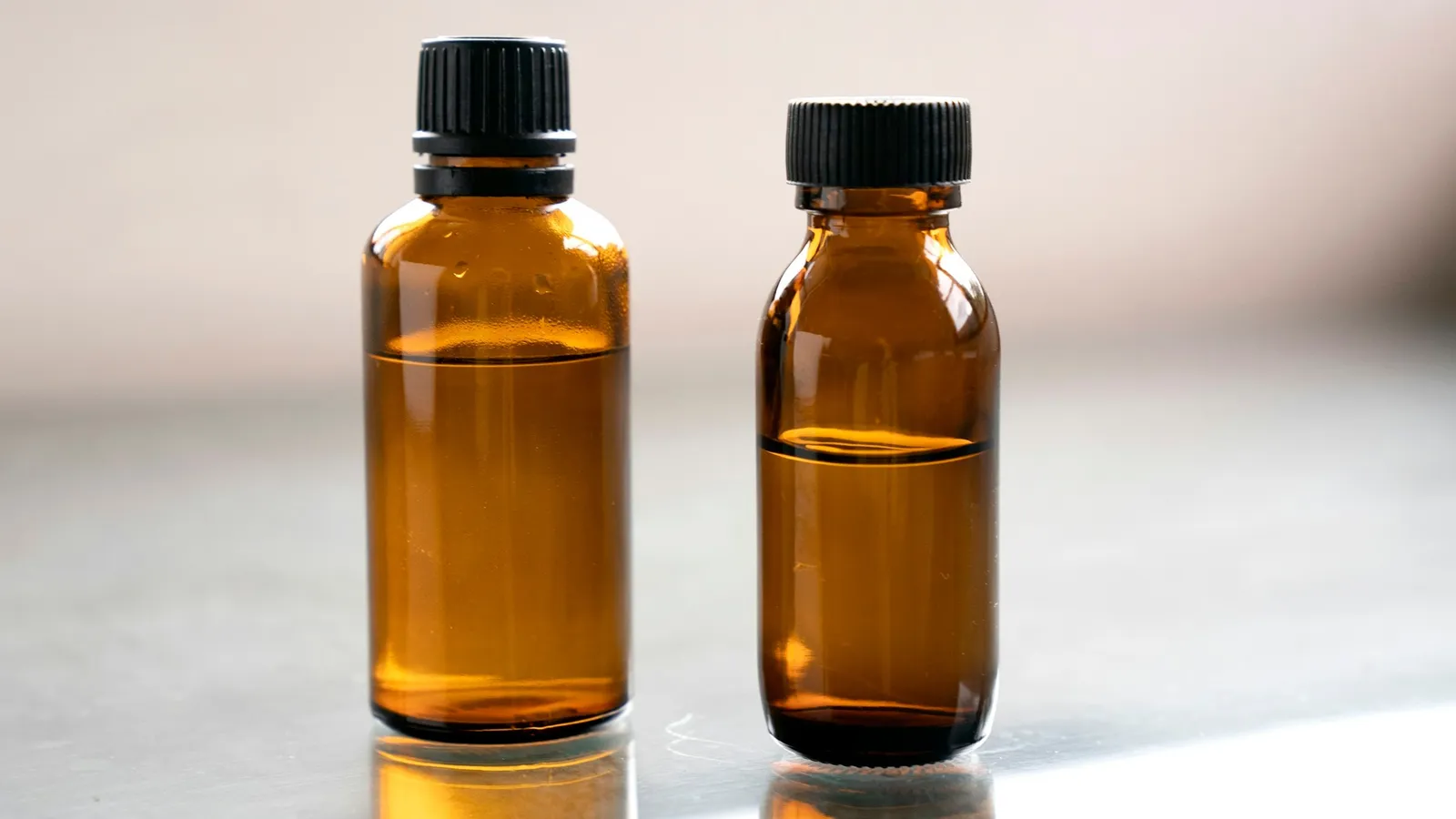Two brown glass reagent bottles