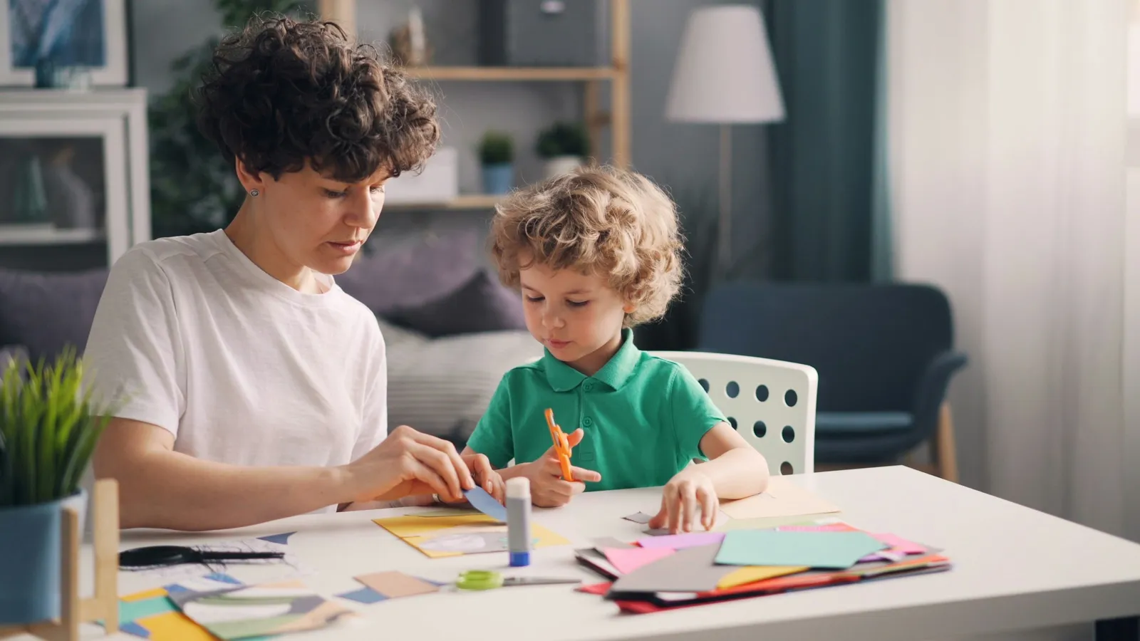 Two children working on schoolwork together at a table