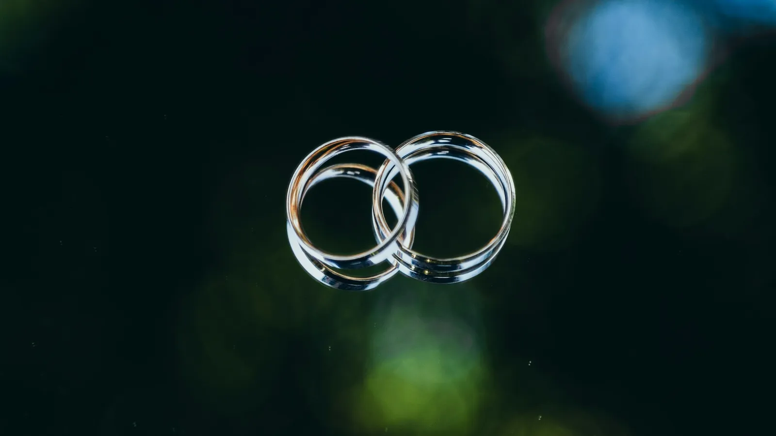 Two clear glass rings overlapping