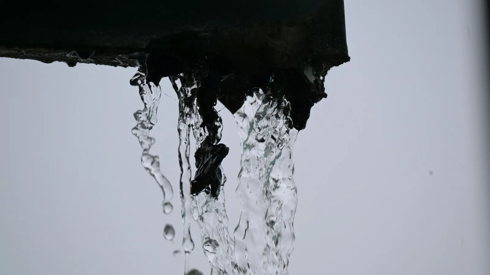 Water pouring out of an opening in streams