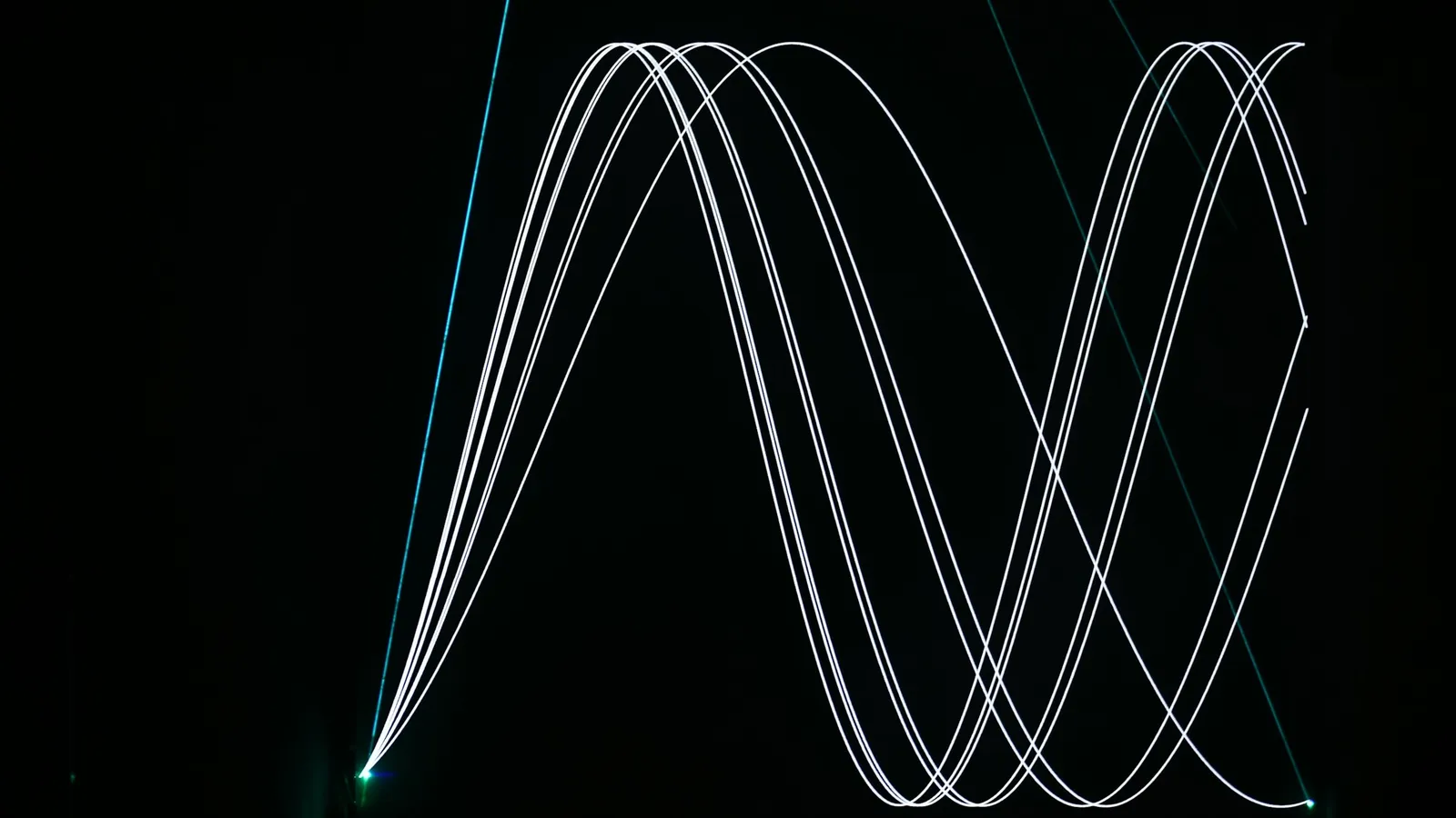 White light trails forming waves on black
