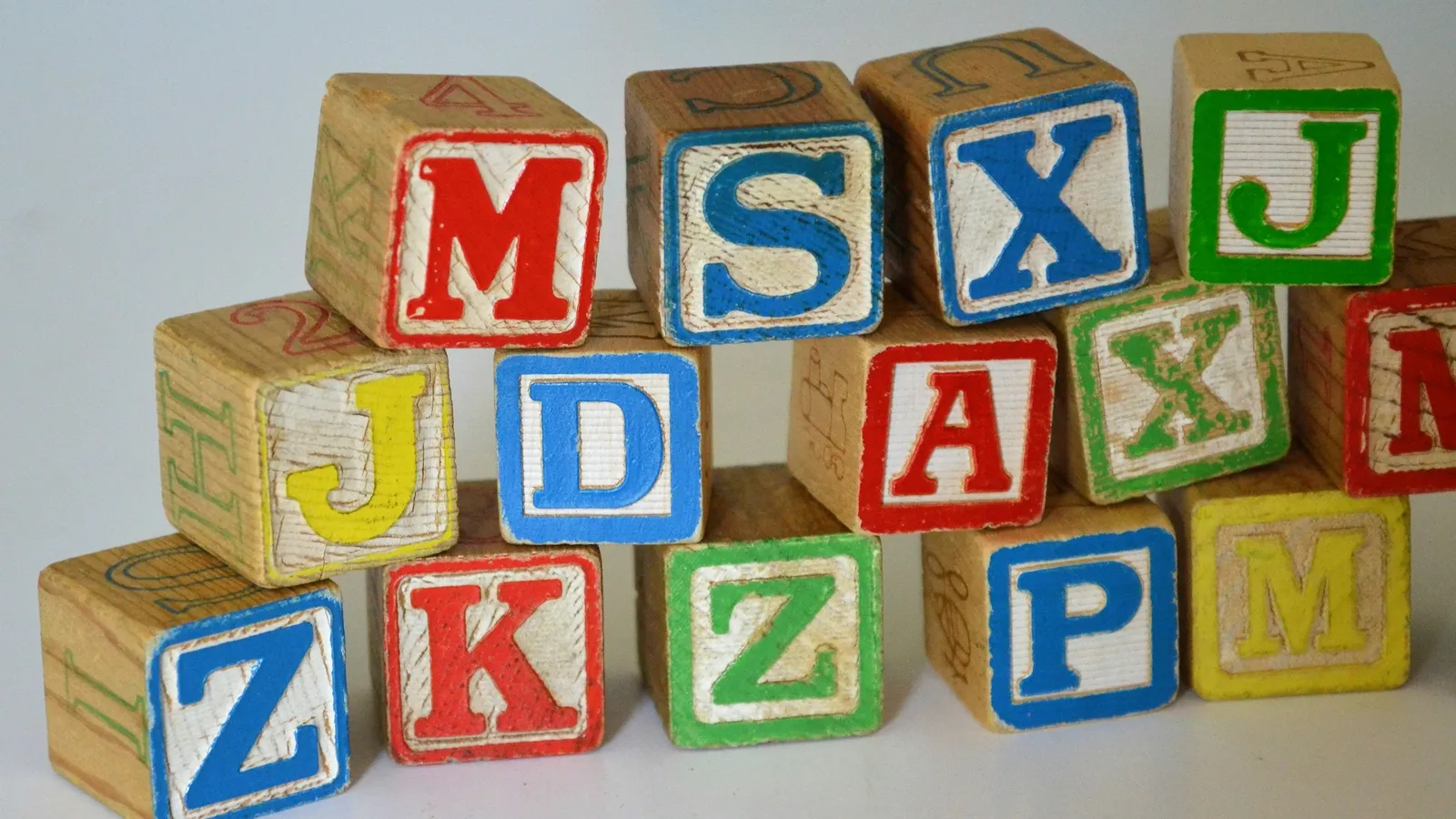 Wooden alphabet blocks with coloured letters