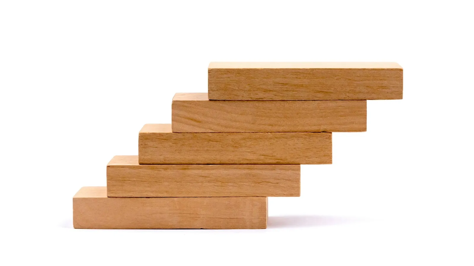 Wooden blocks stacked like evenly spaced steps