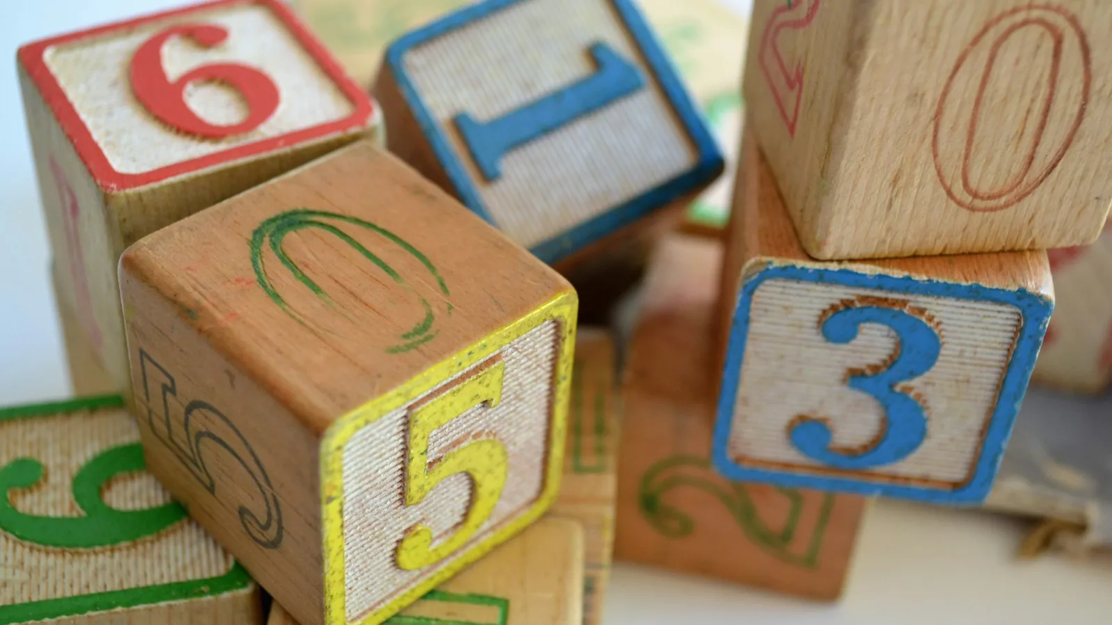 Wooden number blocks stacked together