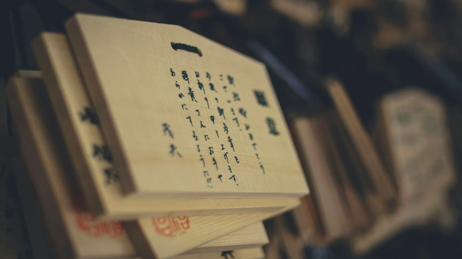 Wooden prayer tablets hanging at a Japanese shrine