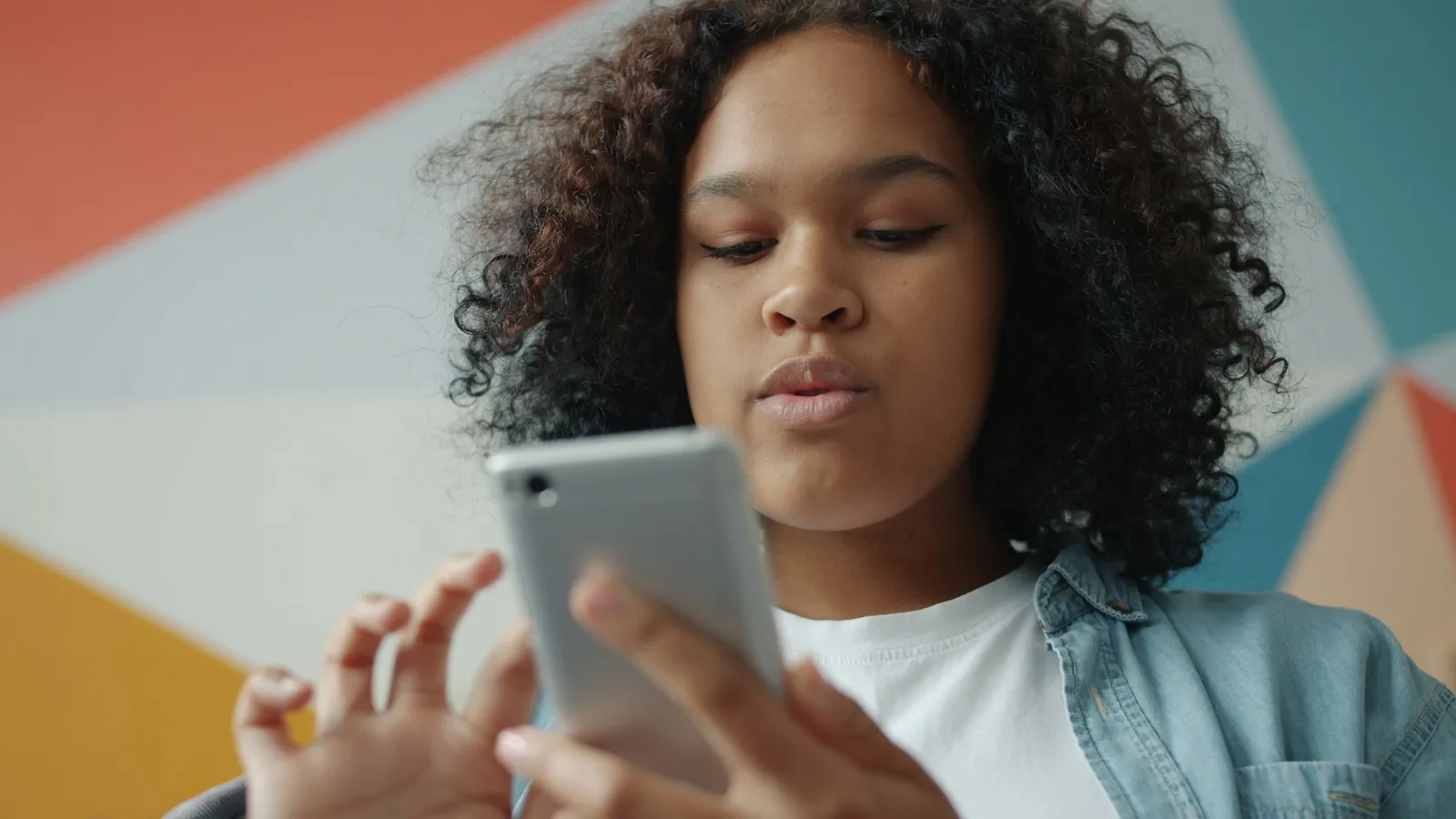 Young woman looking at her smartphone