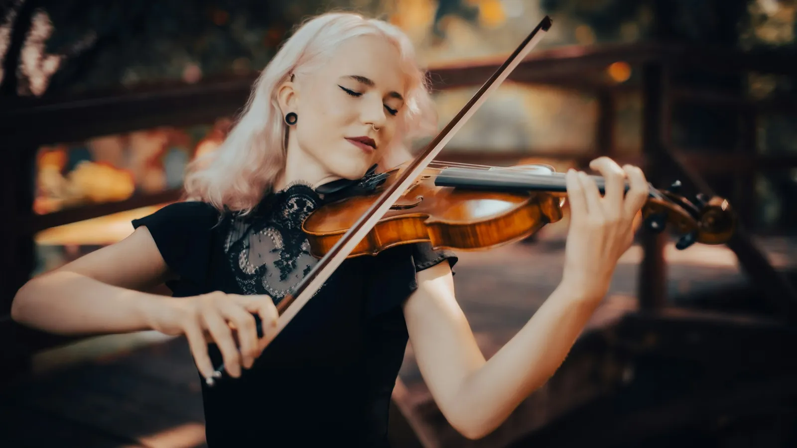 Young woman practising the violin